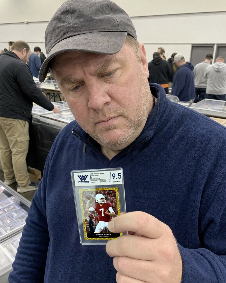 Customer holding a graded card